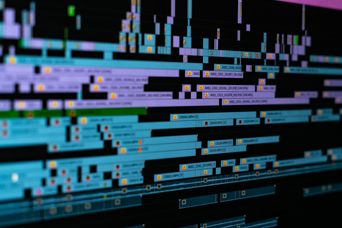 Close-up of computer screen showing video editing project with timeline and clips