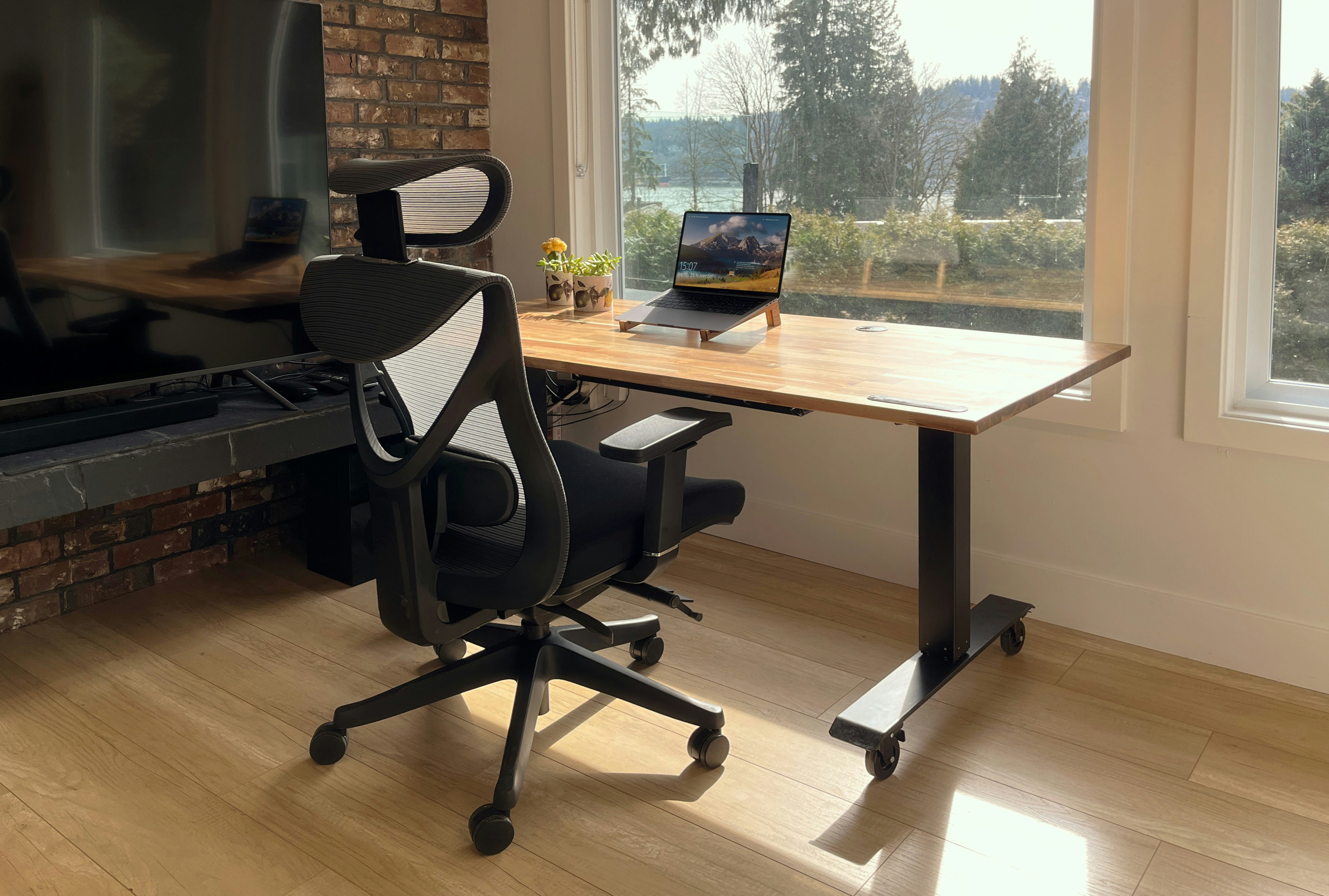 A clean home office desk setup with laptop and chair, demonstrating the kind of workspace where proper chair mat sizing matters for floor protection