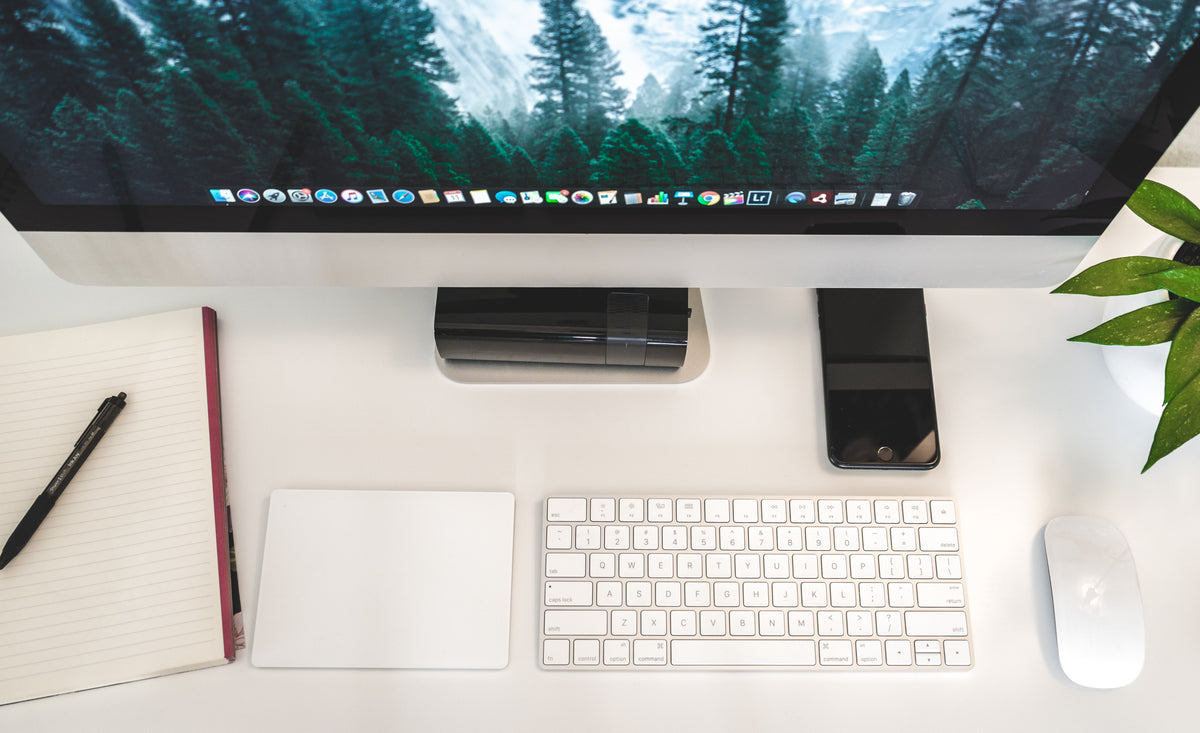 Premium wool felt desk mat with mechanical keyboard and mouse on a dark minimalist desk setup