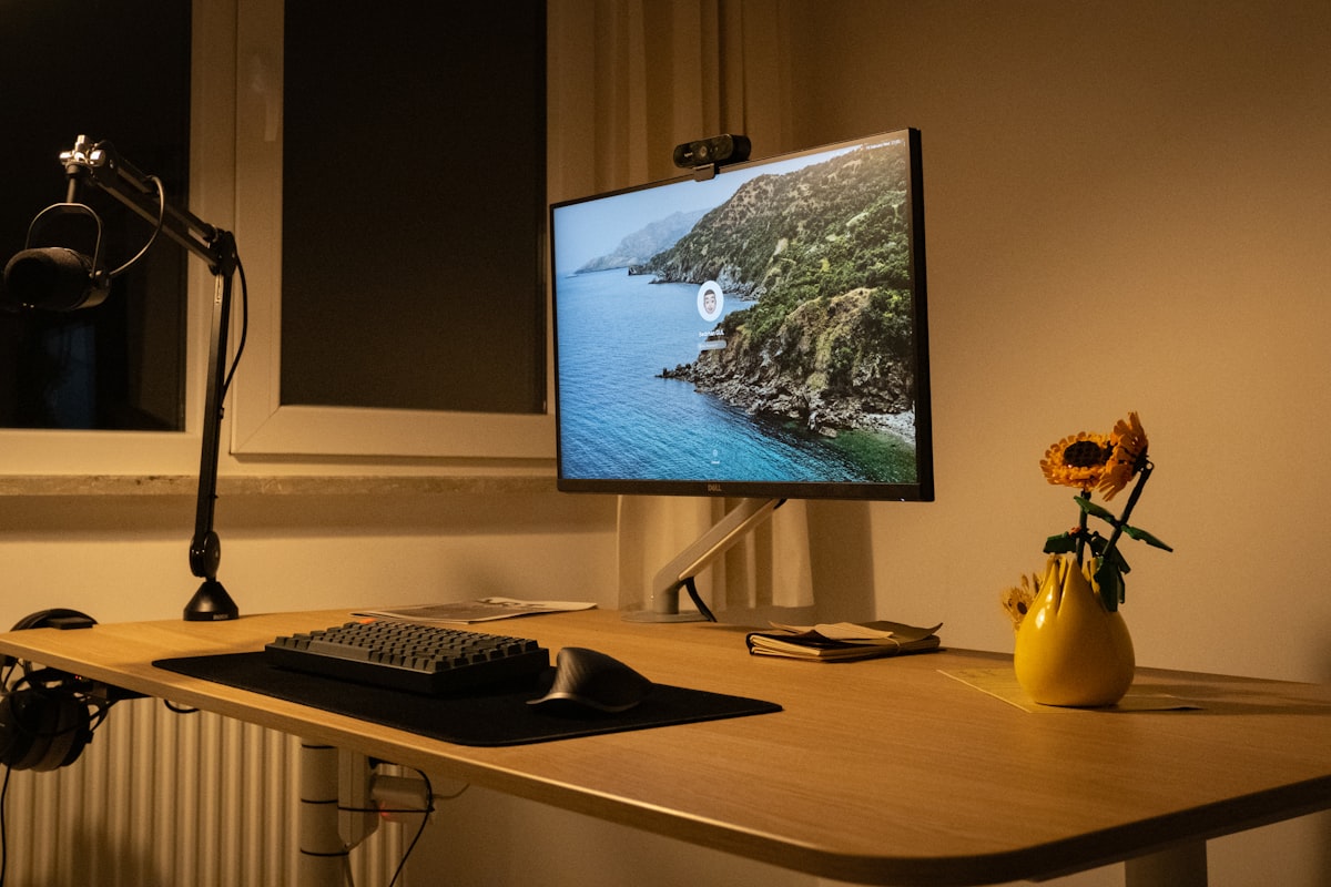 Monitor arm extended with ultrawide display showing weight stress points