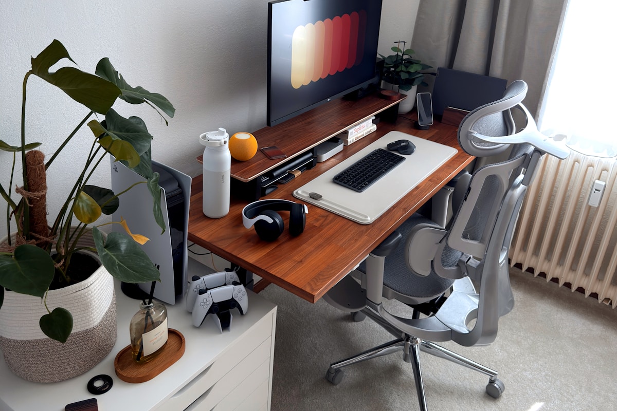 Ergonomic office chair with memory foam seat cushion and lumbar support strap — dark battlestation workspace